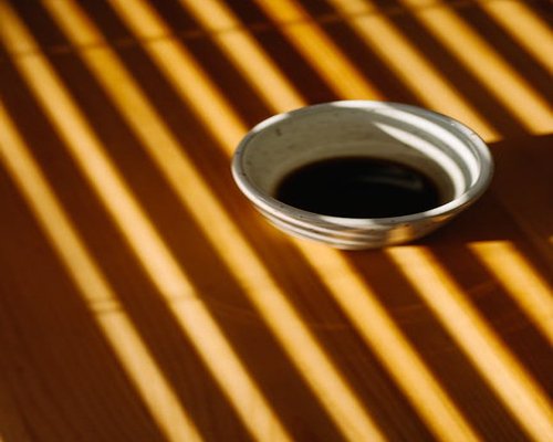 Morning coffee and natural sunlight in Indonesian home